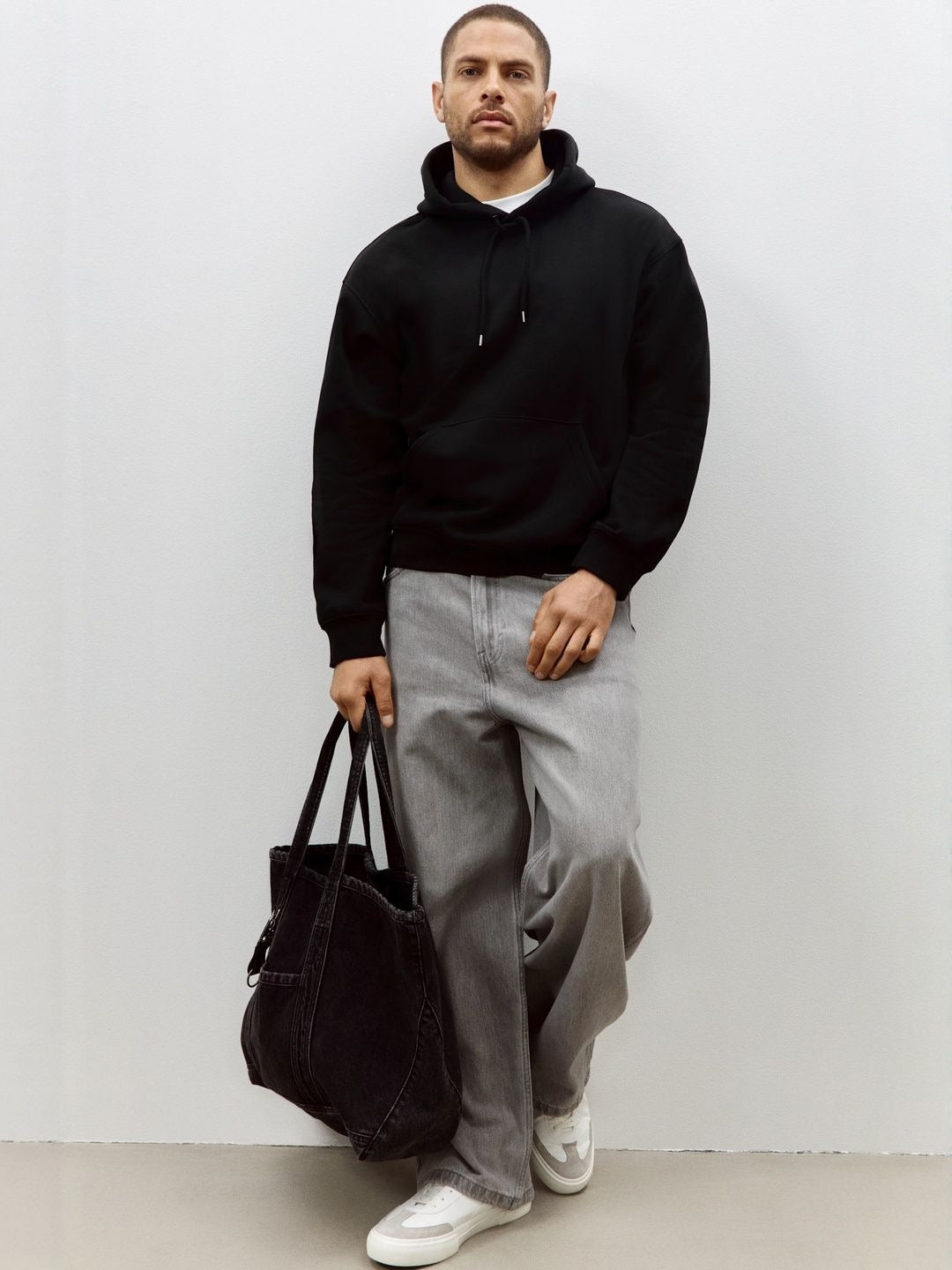 Men Black Relaxed Fit Hoodie – Comfortable Streetwear Style in Pakistan | DOCACCA